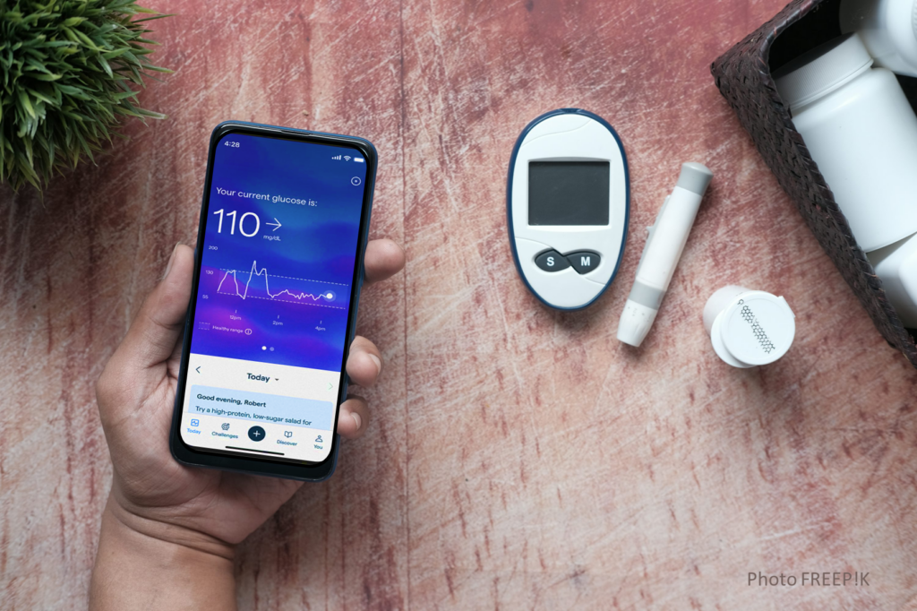 Person checking blood sugar levels with a remote glucose monitoring device.